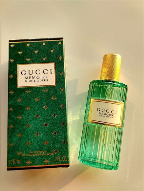 gucci perfume in green bottle.